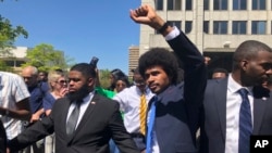 Justin Pearson celebrates with supporters after being reinstated to the the Tennessee House of Representatives by the Shelby County Board of Commissioners building in Memphis, Tennessee, April 12, 2023.