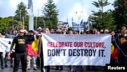 FILE - Aboriginal groups protest against what they say is a lack of detail and consultation on new heritage protection laws, after Rio Tinto destroyed ancient rock shelters for an iron ore mine, in Perth, Australia, Aug. 19, 2021.