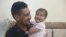 Khalil al-Sawadi plays with his adopted daughter Afraa in Jinderis, Syria, on Aug. 5, 2023. Afraa was born under the rubble of her family home, destroyed by the deadly earthquake that hit Turkey and Syria six months ago, killing her parents and siblings.