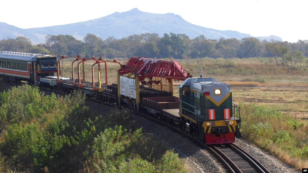 FILE - A train moves in the vicinity of a cross-border rail link between North Korea and Russia, near Tumangang, North Korea, Oct. 4, 2008.