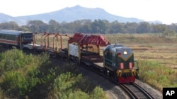 FILE - A train moves in the vicinity of a cross-border rail link between North Korea and Russia, near Tumangang, North Korea, Oct. 4, 2008.