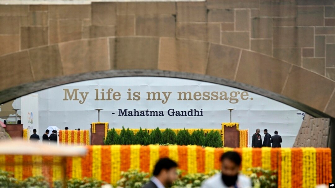 Officials wait for the arrival of the G20 leaders to pay their respects at the Rajghat, Mahatma Gandhi memorial, in New Delhi, India, Sept. 10, 2023.