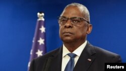 FILE - U.S. Secretary of Defense Lloyd Austin looks on during a joint press conference with Israeli Defense Minister Yoav Gallant at Israel's Ministry of Defense in Tel Aviv, Israel, Dec. 18, 2023.