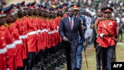 Kenyan President William Ruto (C) inspect a ceremonial guard of honor during of the celebrations of Kenya's 60th Independence Day, also known as Jamhuri Day, at the Uhuru Gardens in Nairobi on December 12, 2023.