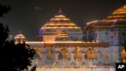 A temple dedicated to Lord Ram is lit up two days before its grand opening in Ayodhya, India, Jan. 20, 2024. 