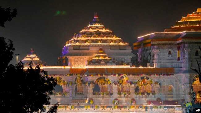 A temple dedicated to Lord Ram is lit up two days before its grand opening in Ayodhya, India, Jan. 20, 2024.