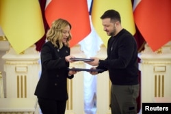 Ukraine's President Volodymyr Zelenskyy and Italian Prime Minister Giorgia Meloni attend a signing ceremony, in Kyiv, Ukraine, Feb. 24, 2024. (Ukrainian Presidential Press Service/Handout via Reuters)