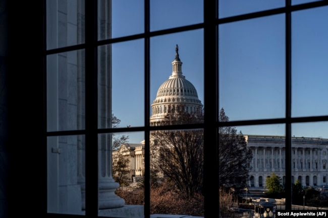 FILE - The U.S. Capitol is seen through a window in the Russell Senate Office Building, March 15, 2023. (AP Photo/J. Scott Applewhite)