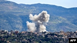 Smoke billows from the site of an Israeli airstrike that targeted the southern Lebanese village of Khiyam on March 12, 2024.