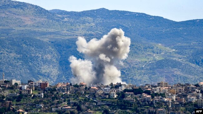 Smoke billows from the site of an Israeli airstrike that targeted the southern Lebanese village of Khiyam on March 12, 2024.