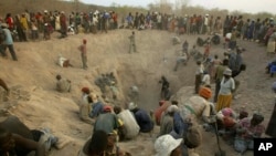FILE - Miners dig for diamonds in Marange, eastern Zimbabwe, Nov. 1, 2006. 