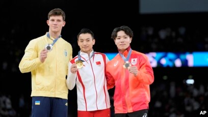 Zou Jingyuan defends parallel bars title on final day of artistic  gymnastics at Paris Olympics