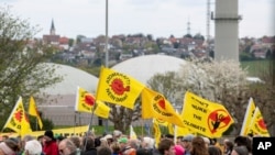 Activists celebrate a shutdown party in front of the nuclear power plant 'Isar 2' in Neckarwestheim, Germany, April 15, 2023.