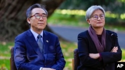 South Korea's Minister of Foreign Affairs Cho Tae-yul, left, and Australia's Foreign Minister Penny Wong sit during a welcome ahead of an Australia and South Korea Foreign and Defense Ministers meeting in Melbourne, Australia, May 1, 2024.