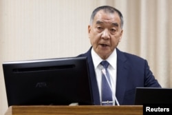 FILE - Taiwanese Defense Minister Chiu Kuo-cheng speaks during a parliament session in Taipei, Taiwan, April 6, 2023.