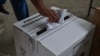 FILE - A voter casts his ballot in Canuto, Ecuador, Aug. 20, 2023. 