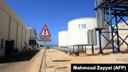 (FILE) Storage tanks at a power plant in Lebanon.