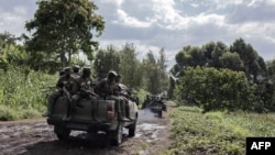 FILE: M23 soldiers leave Rumangabo camp after the meeting between EACRF officials and M23 rebels in eastern DRC - UN chief Antonio Guterres on March 6, 2023, urged the M23 rebels to honor an impending ceasefire and to fully withdraw from the conflict-ridden country.