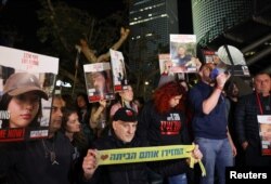 People protest in Tel Aviv following an announcement by Israel's military that soldiers had mistakenly killed three Israeli hostages being held in Gaza by Palestinian Islamist group Hamas, Dec. 15, 2023.