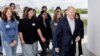 German Chancellor Olaf Scholz, leaves the terrace of the Chancellery with participants after a group picture during an event marking Girls' Day at the Chancellery in Berlin, April 23, 2024. 