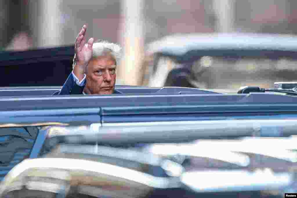 Former U.S. President Donald Trump gestures on the day of his hush money criminal trial, outside Trump Tower, in New York City.