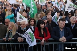 Supporters of PASOK Socialist party listen to a speech by PASOK Socialist party leader Nikos Androulakis in a pre-election rally in Athens, Greece, May 17, 2023.
