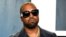 FILE - Kanye West arrives at the Vanity Fair Oscar party on Feb. 9, 2020, in Beverly Hills, Calif. 