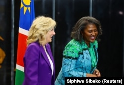 Namibian First Lady Monica Geingos and U.S. First Lady Jill Biden smile as they walk at the State House in the capital Windhoek, in Namibia, February 22, 2023. (REUTERS/Siphiwe Sibeko)