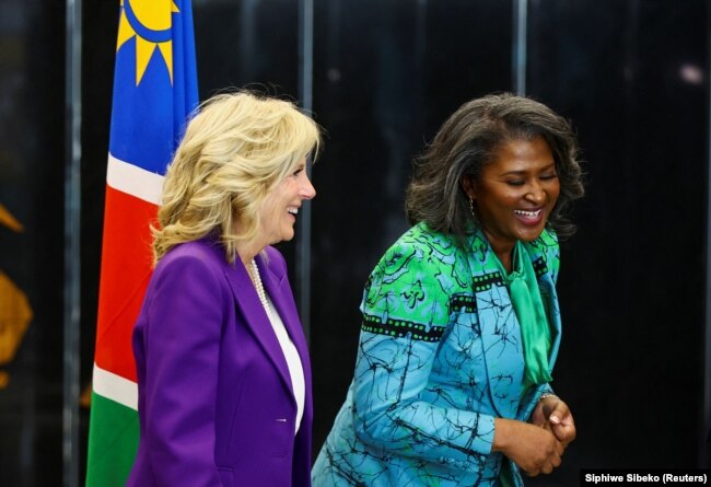 Namibian First Lady Monica Geingos and U.S. First Lady Jill Biden smile as they walk at the State House in the capital Windhoek, in Namibia, February 22, 2023. (REUTERS/Siphiwe Sibeko)