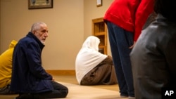 Dr. Mohammad Saber Bahrami participates in prayers at the Islamic Center of Muncie, Ind., March 3, 2023. His wife, Bibi Bahrami, is a subject of the documentary "Stranger at the Gate."