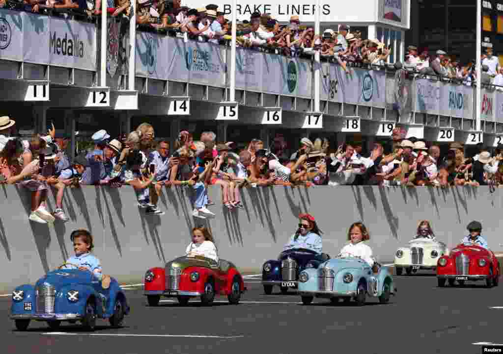 Children take part in the Settrington Cup Pedal Car Race as motoring enthusiasts attend the Goodwood Revival, a three-day historic car racing festival in Goodwood, near Chichester, southern Britain, Sept. 9, 2023.