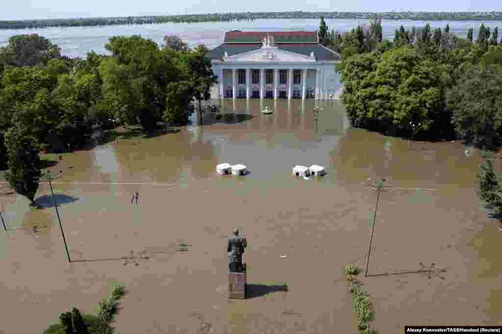 A view shows the House of Culture on a flooded street in Nova Kakhovka after the nearby dam was breached in the Kherson Region, Russian-controlled Ukraine.&nbsp;Ukraine and Russia accused each other of blowing up the Kakhovka dam, setting off a new crisis in the war-torn country.