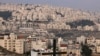FILE - A picture taken from the Palestinian biblical city of Bethlehem shows a view of the Israeli settlement of Har Homa, in the occupied West Bank, on Dec. 7, 2023. 