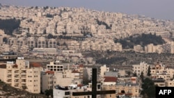 FILE - A picture taken from the Palestinian biblical city of Bethlehem shows a view of the Israeli settlement of Har Homa, in the occupied West Bank, on Dec. 7, 2023. 