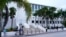 FILE - News media wait outside of the U.S. Courthouse in Fort Pierce, Florida, on July 18, 2023. U.S. District Judge Aileen Cannon has indicated that the classified-documents case against former President Donald Trump will be held there