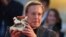 FILE - William Friedkin poses on the red carpet after receiving the Golden Lion for Lifetime Achievement during the Venice Film Festival on Aug. 29, 2013. Friedkin, Oscar-winning director of "The French Connection" and "The Exorcist," died Aug. 8, 2023. 