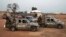 In this screen grab taken from video, Nigerian Army vehicles are parked at the village where children were kidnapped in Kuriga, Kaduna state, March 7, 2024. 