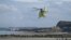 A helicopter of the Emergency medical services takes off from the Wimereux dike on April 23, 2024, after the recovery of the body of five migrants, who died overnight trying to cross the Channel from France to Britain on their overcrowded small boat. 