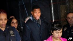 US actor Jonathan Majors leaves a courtroom in New York on Monday, December 18, 2023.