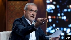 Reformist presidential candidate Masoud Pezeshkian, who is a parliament member, attends a debate of the candidates at the TV studio in Tehran, Iran, June 17, 2024, in this picture made available by Iranian state-run TV, IRIB.