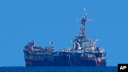 FILE - A dilapidated but still active Philippine Navy ship BRP Sierra Madre sits at the Second Thomas Shoal, locally known as Ayungin Shoal, at the disputed South China Sea on Aug. 22, 2023.