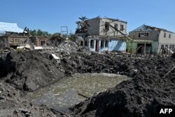 This photograph taken on June 19, 2023 shows houses and buildings destroyed by a Russian missile attack, in the town of Kramatorsk, Donetsk Region.