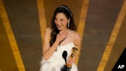 Michelle Yeoh accepts the award for best performance by an actress in a leading role for 'Everything Everywhere All at Once' at the Oscars on March 12, 2023, at the Dolby Theatre in Los Angeles. 