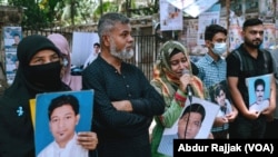 Holding the photo of her father — an alleged victim of enforced disappearance — a girl breaks down in a peaceful rally in Dhaka, Bangladesh, on June 24, 2023. Several hundred people have been victims of enforced disappearance in Bangladesh in the past years.