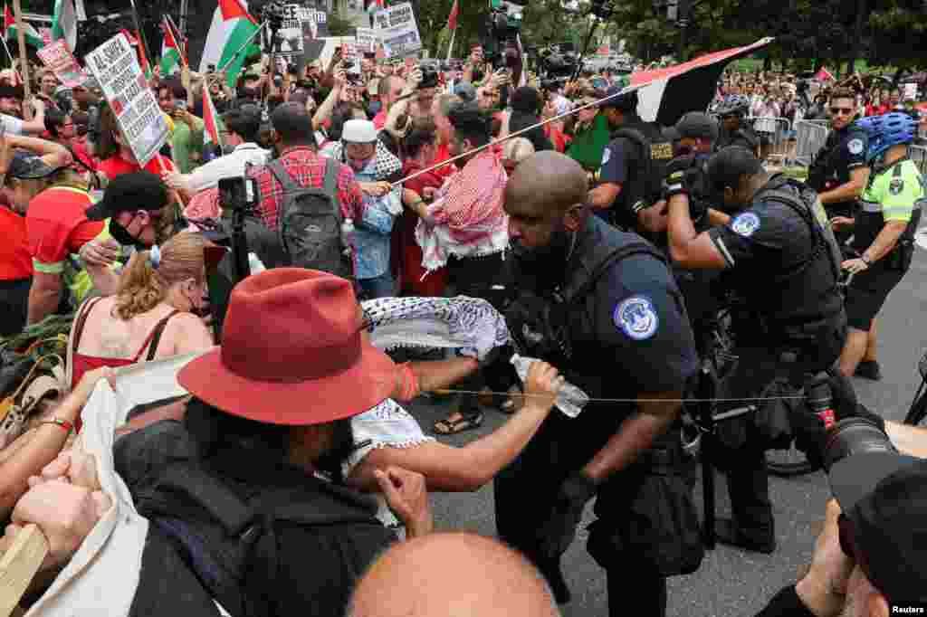 U.S. Capitol Police officers use pepper spray on pro-Palestinian demonstrators, on the day Israeli Prime Minister Benjamin Netanyahu addresses a joint meeting of Congress, on Capitol Hill, in Washington, July 24, 2024. 