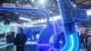 FILE - A man walks by a TikTok booth at the Appliance & Electronics World Expo in Shanghai, China, March 14, 2024. TikTok and parent company ByteDance laid out their arguments this week why a new law that could see the service effectively banned in the U.S. should be struck down.