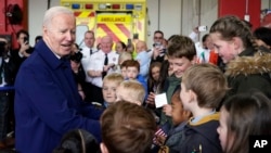 U.S. President Joe Biden greets children at Dublin International Airport in Dublin, Ireland, April 12, 2023.
