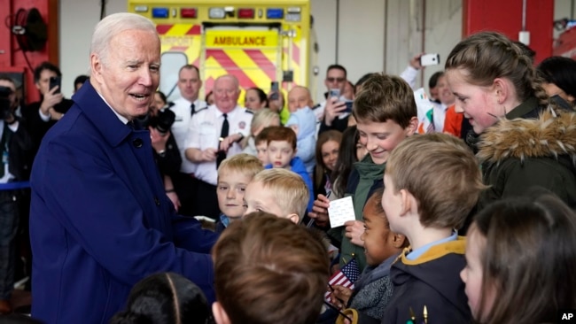 U.S. President Joe Biden greets children at Dublin International Airport in Dublin, Ireland, April 12, 2023.