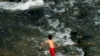 A young boy finds relief in the River Nile amid the intense heat. Climate projections by the International Energy Agency show this populous and water-scarce desert country is warming faster than the global average. North of Cairo, Egypt, May 6, 2024. (Hamada Elrasam/VOA)