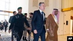U.S. Secretary of State Antony Blinken, center, arrives to meet with Saudi Foreign Minister Prince Faisal bin Farhan, in Riyadh, Saudi Arabia, Oct. 14, 2023